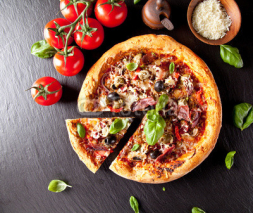 Fototapety Fresh italian pizza served on black stone