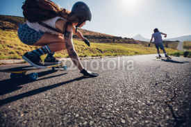 Fototapety Young woman skating with her friend