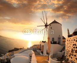 Fototapety Windmill in Santorini against sunset, Greece