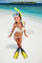 Naklejki Fun woman with snorkeling equipment on the beach