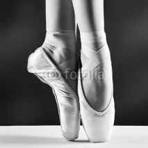 Obrazy i plakaty A photo of ballerina's pointes on black background