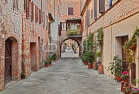 Naklejki street in the village Buonconvento, Siena, Tuscany, Italy