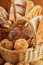Fototapety Composition with bread and rolls in wicker baskets