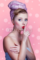 Naklejki Beautiful young sexy pin-up girl with surprised expression, on p