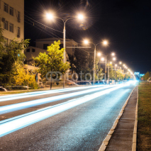 Naklejki Aspalt road with illuminations in the city
