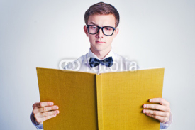 Fototapety Young man reading book