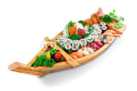 Naklejki Collection of species sushi on the decorative plate ship. On a w