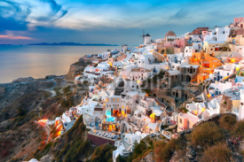 Naklejki Picturesque famous view, Old Town of Oia or Ia on the island Santorini, white houses and windmills at sunset, Greece