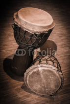 Naklejki Traditional wooden african djembe drumon stage
