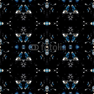Seamless ethnic kaleidoscope pattern. Checks and cross elements. Brown and gray natural tones on black background.