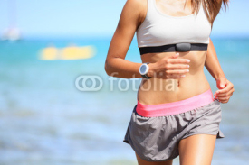 Naklejki Runner woman with heart rate monitor running