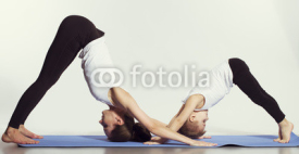 Naklejki mother and son doing yoga (sports exercises), have fun and spend a good time together . isolated on white. the concept of a healthy lifestyle