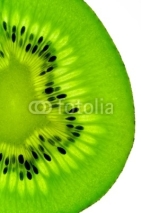 Naklejki kiwi fruit  slice on a light table (vertical back