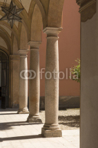 Obrazy i plakaty old stone columns in courtyard, Volpedo, Italy