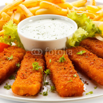 Naklejki Fried fish fingers, French fries and vegetables