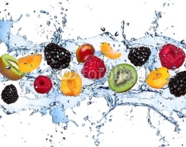 Naklejki Fresh fruits in water splash, isolated on white background