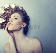 Fototapety Beautiful young woman with flowers in their hair