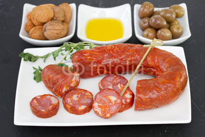smoked sausages with olives and nuts