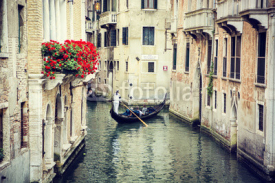 Naklejki Canal in Venice, Italy with gondola