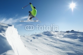 Naklejki Jumping Skier in alpine mountains