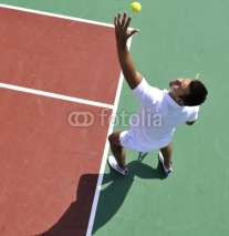 Naklejki young man play tennis outdoor