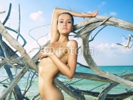 Naklejki Beautiful woman on beach