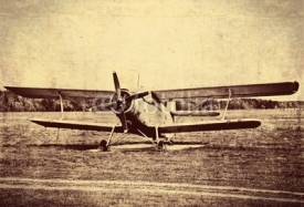 Fototapety Vintage photo of an old biplane