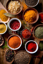 Naklejki Assorted spices on wooden background