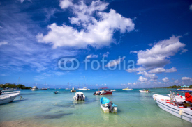 Naklejki Boats in turquoise bay in Dominican Republic