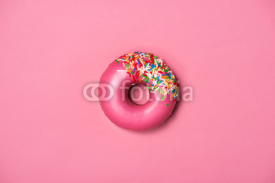 Naklejki Donuts with icing on pastel pink background. Sweet donuts.