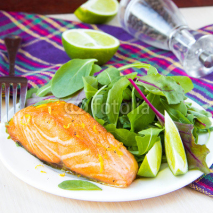 Naklejki Grilled fillet of red salmon and salad with green leaves of lett