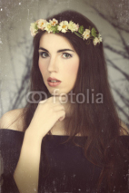 Naklejki Girl with style makeup and flower. Photo in vintage color style.