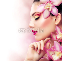 Naklejki Beautiful Girl With Orchid Flowers. Perfect Make-up