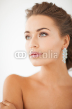 Fototapety woman wearing shiny diamond earrings