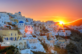 Naklejki Old Town of Oia on the island Santorini, white houses and church with blue domes at sunrise, Greece
