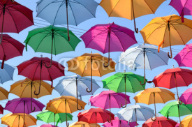 Fototapety colorful umbrellas with blue sky in the background