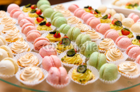 Naklejki Tray with delicious cakes and macaroon