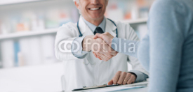 Naklejki Doctor and patient shaking hands