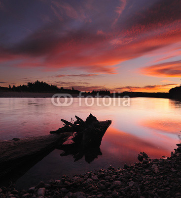 Fiery sky on the river at New Zealand