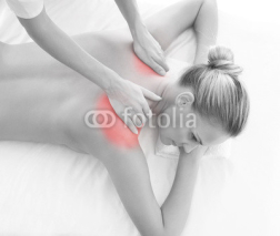 Obrazy i plakaty A woman getting massaging treatment over white background