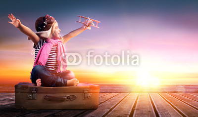 Dream journey - Little Girl On Vintage Suitcase At Sunset 
