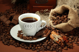 Fototapety cup of coffee and coffee beans on brown background