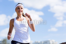 Naklejki young woman jogging