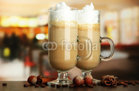 Naklejki Fragrant coffee latte in glasses cups with spices,
