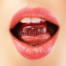 woman sucking sweet candy closeup lips teeth tongue