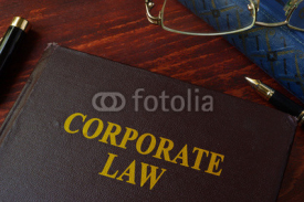 Fototapety Book with title corporate law on a table.