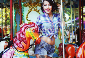 Fototapety Rejoicing. Merriment. Excited Lively Woman in Funfair Smiling