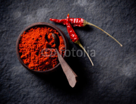 Naklejki Red pepper spices on stone background