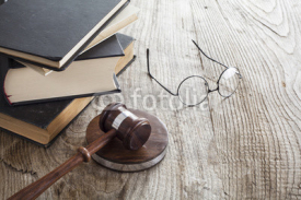Books with mallet on table
