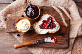 Fototapety Fresh bread with homemade butter and blackcurrant jam